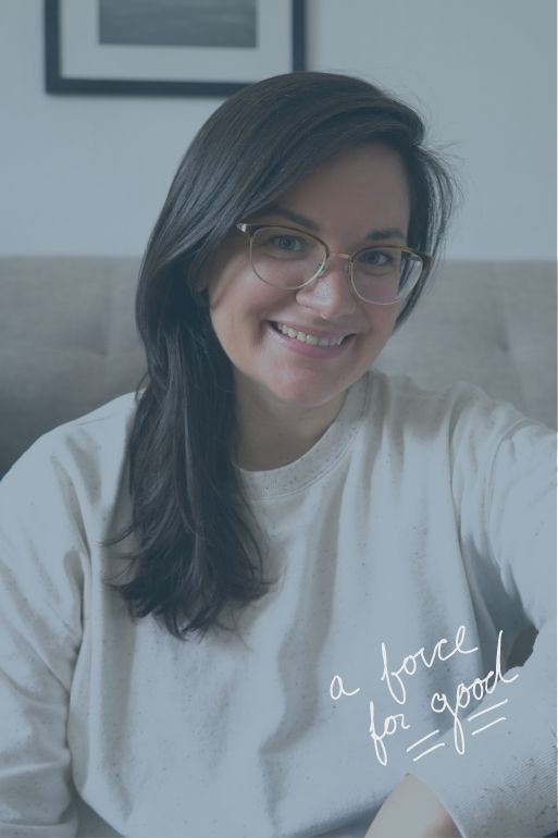 dark haired girl sitting with a white sweatshirt